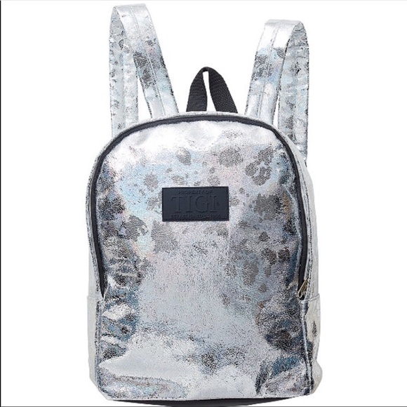 TIGI Handbags - *TIGI Silver holographic backpack like new
